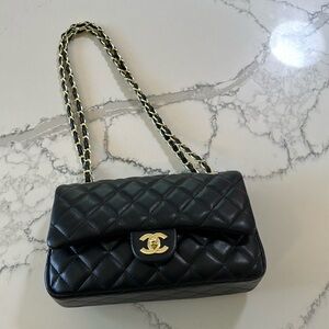 Black crossbody or shoulder leather purse with gold new and unused